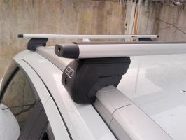 Багажник на крышу для Mitsubishi Pajero Sport (2008-2016) на интегрированные рейлинги (аэродинамические дуги) Евродеталь